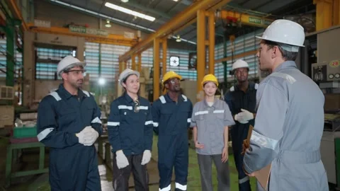 Team of engineers discussing work plan in the industry Stock Footage 332201455