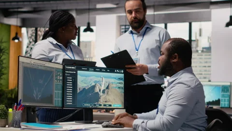 Team of engineers in office doing green energy production technology testing Stock Footage 315616805