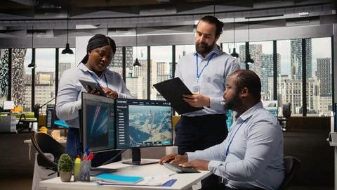 Team of engineers in office doing green energy production technology testing Stock Photos
