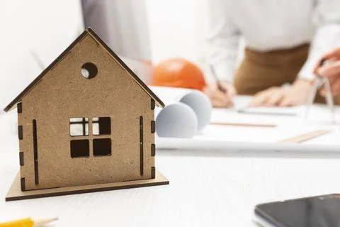 A team of engineers or architects develops a blueprint for a building Stock Photos