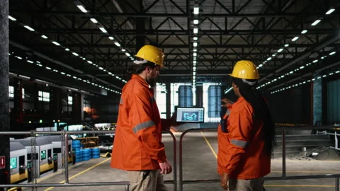 Team of engineers, robotics software, laptop tools, heavy industry workshop Stock Footage 330140942