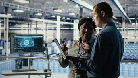 Team of engineers in server hub optimizing deep learning AI systems Stock Footage 314805122