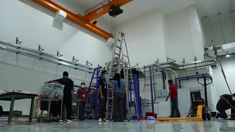 Team of Engineers, Technicians, Professionals and Workers, Working on Assembly a Stock Footage 167599906