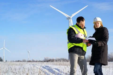 Team of engineers with wind turbines Stock Photos