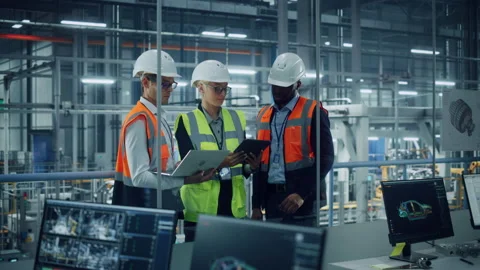 Team Engineers Working in Office at Electric Car Assembly Factory Stock Footage 159478788