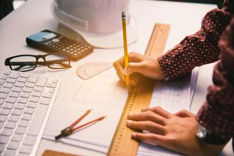 Team of engineers working together in a architect office. Stock Photos