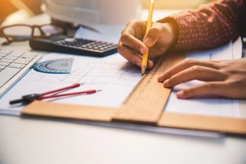 Team of engineers working together in a architect office. Stock Photos