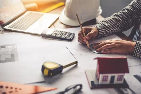 Team of engineers working together in a architect office. Stock Photos