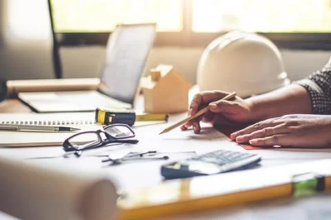 Team of engineers working together in a architect office. Stock Photos