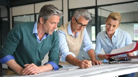 Team of engineers working together on project Stock-Footage 63360640