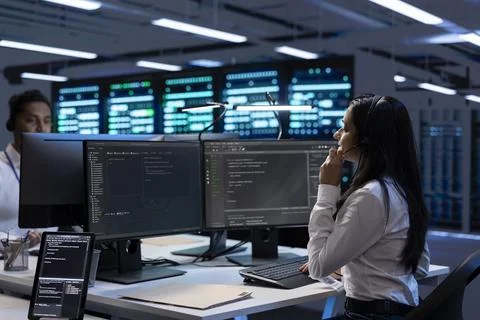 Team of experts in data center providing customer support, troubleshooting Stock Photos