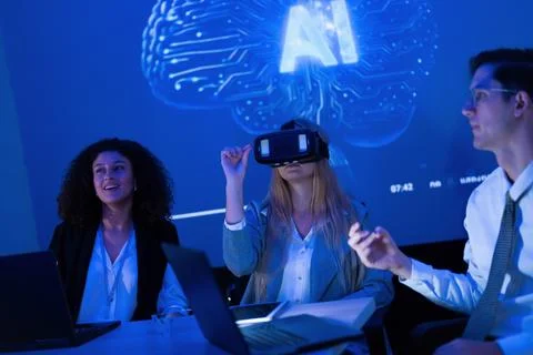 Team explores virtual reality and artificial intelligence during a creative.. Stock Photos