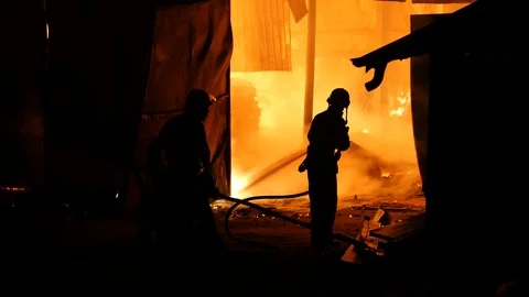 Team Of Firefighters Trying To Put Down A Fire Stock Footage 91329583
