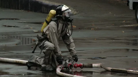 A team of firefighters using high pressure hoses Stock-Footage 85715434