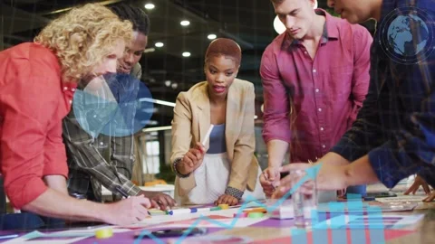 Team of five leaning over table sparking chart overlay as lead woman pointing Stock Footage 333494536