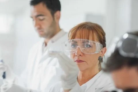 Team of focused scientists at work 스톡 사진