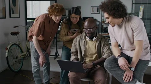 Team of Four Diverse Computer Programmers Developing Application Together Stock Footage 299246823