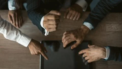 Team of freelance developers using digital tablet checking out new app updates Foto stock