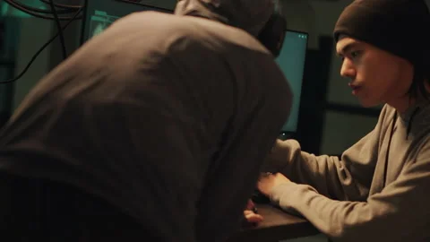 Team of hackers committing cybercrime or illegal activities Video stock 230192001