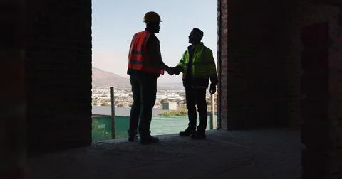 Team, handshake and men in construction site, achievement and collaboration for Stock Photos