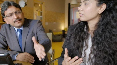 A team having a tension session while they try to come up with a solution sittin Stock Footage 101936292