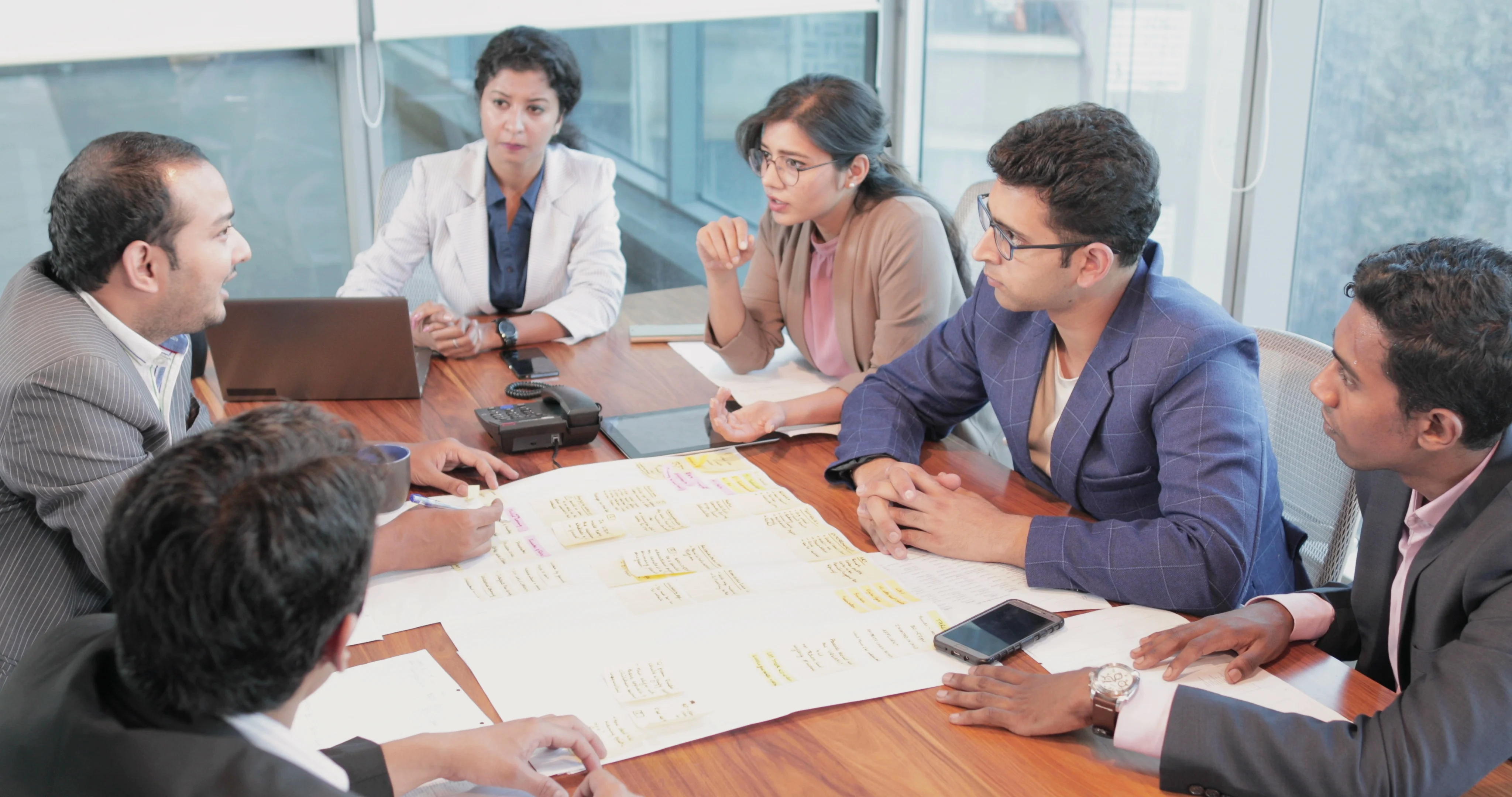 Professional business meeting with financial analysis