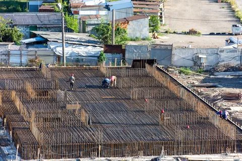 A team of individuals is collaborating on a construction project Stock Photos