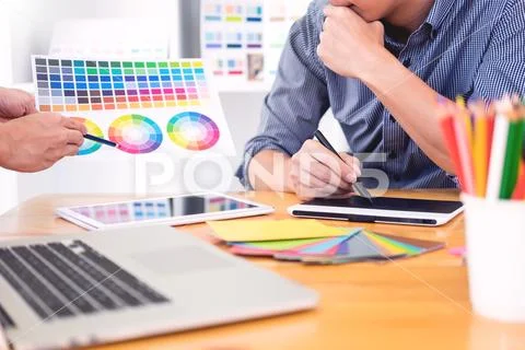 Team interior designer drawing a new project using graphic computer and choos Stock Photos