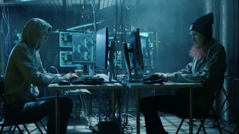 Team of Internationally Wanted Boy and Girl Hackers Organize Advanced Virus. Stock Footage 76073360