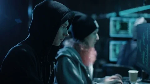 Team of Internationally Wanted Boy and Girl Hackers Organize Advanced Virus Stock Footage 76075733