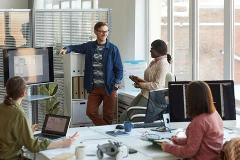 Team of IT Developers Discussing Project at Meeting 스톡 사진