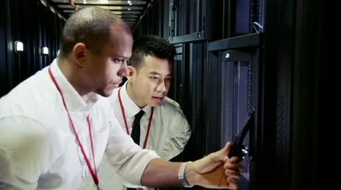 Team of IT engineers working in a data centre Stock Footage 21393332