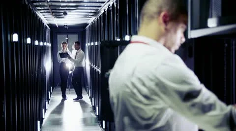 Team of IT engineers working in a data centre Stock Footage 21426667