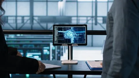 Team of IT professionals looking over data center checkup checklist paperwork 스톡 사진