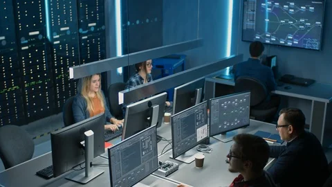 Team of IT Programers Working on Desktop Computers in Data Center System Control Stock Footage 103270147