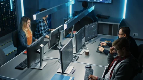 Team of IT Programers Working on Desktop Computers in Data Center System Control Stock Footage 103270257