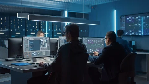 Team of IT Programers Working on Desktop Computers in Data Center System Control Stock Footage 103270390