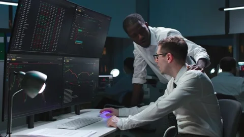 Team of it programmers working on desktop computers in data center control room Stock Footage 181143277