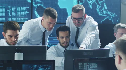 Team of IT Security Professionals Working in Monitoring Room Stock Footage