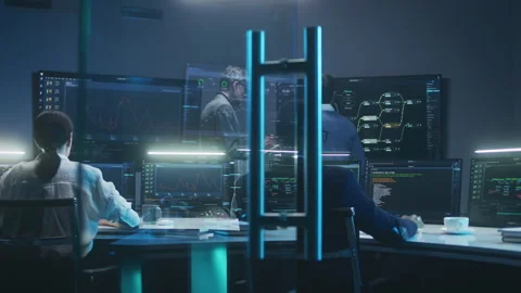 Team of IT technical specialists and software programmers work in monitoring Stock Footage 244413059