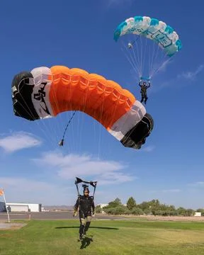 Team landing after a skydive Stock Photos