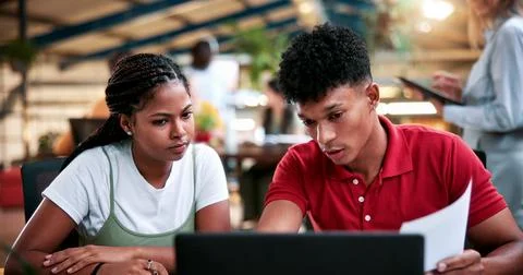 Team, laptop and creative feedback in office with document for update, repo.. Stock Photos