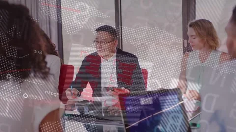 Team lead speaking, writing, tapping tablet causing business data overlay across Stock Footage 335466095