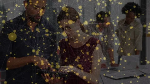 Team lead tapping tablet and animating chart while analyst scrolling notes Stock Footage 312829178