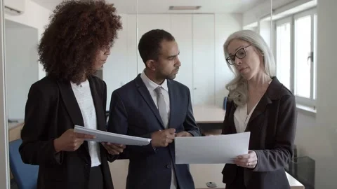 Team leader checking managers report Stock Footage 137515840