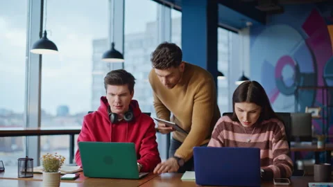 Team leader checking work two managers at office space closeup. Group colleagues Stock Footage 340108205