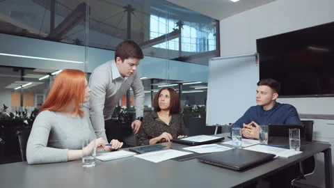 Team leader reporting on progress during business meeting Stock Footage 147859460