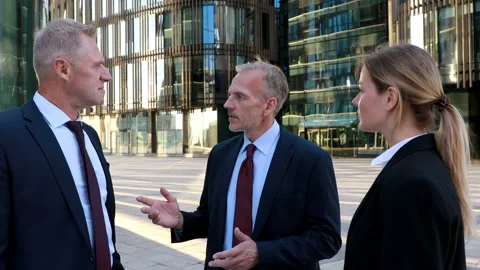 Team leader talking to colleagues during break on international business Stock Footage 134940799