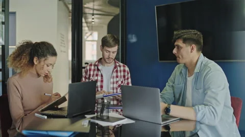 Team leader talking to software developers in office, modern technology, meeting Stock Footage 159815724