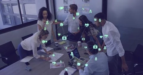 Team leaning, marking docs and typing, starting animated overlay linking charts Stock Photos